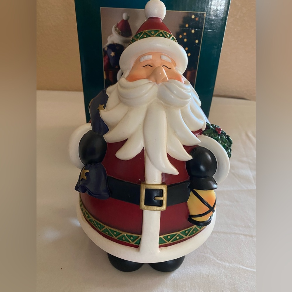 DECORATIVE SANTA FIGURINE, Holding A Toy Sack And A Lantern